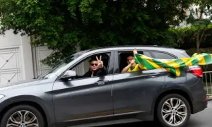 Supporters of Brazilian presidential candidate Flavio Bolsonaro, from the Liberal Party (PL), drive by the residence of Brazilian President Luiz Inacio Lula da Silva, the Workers' Party (PT) candidate for presidential re-election, in Sao Paulo, Brazil on October 25, 2026. — Reuters