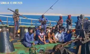 Crew members of an oil tanker hijacked by Somali pirates in April, in a video taken on June 12. — screengrab from video via Shazia Hasan